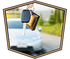 keys hanging in front of blurred car