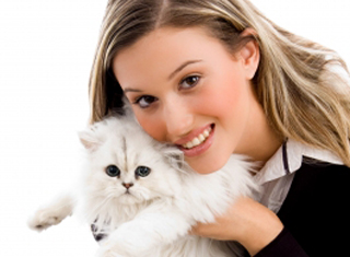 Young woman holding a white fluffy cat 