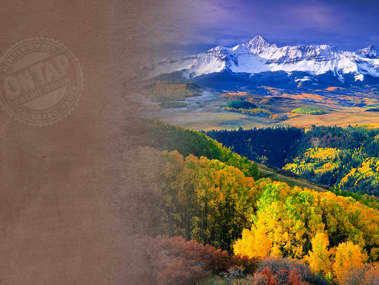 Mountain scene with white caps and trees with yellow leaves