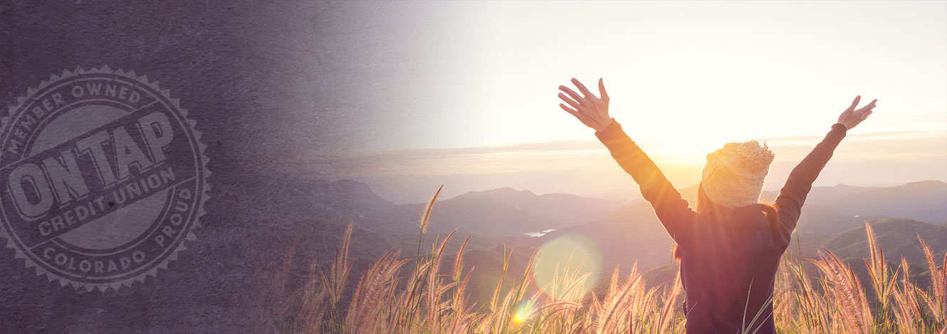 women with arms stretched in field