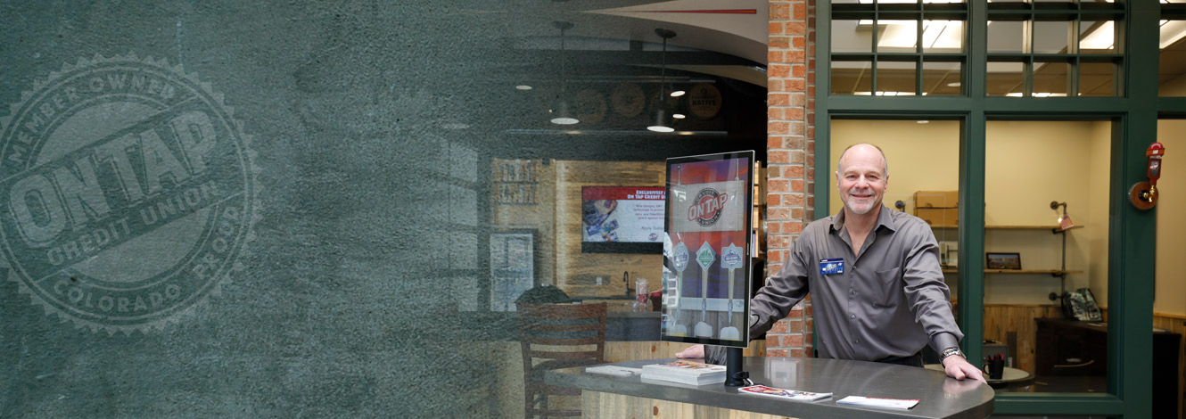on tap employee stands in arvada lobby