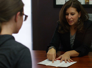 Banker meeting with a customer across a desk