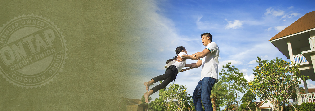 Man playing in back yard with daughter