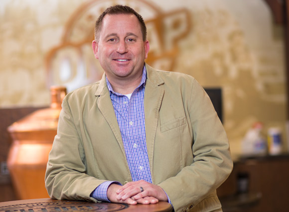 Bryan Thomas standing in the On Tap Credit Union Golden Branch