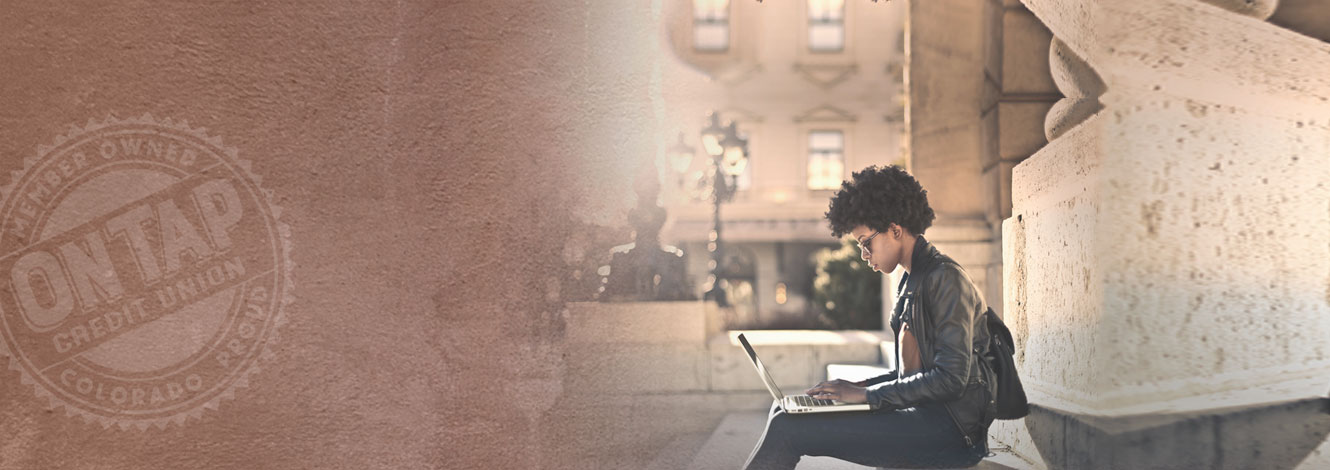 women working on computer outside