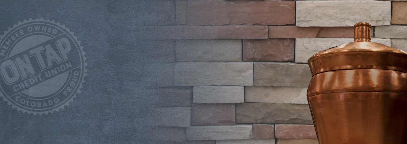 Copper kettle and brick masonry background